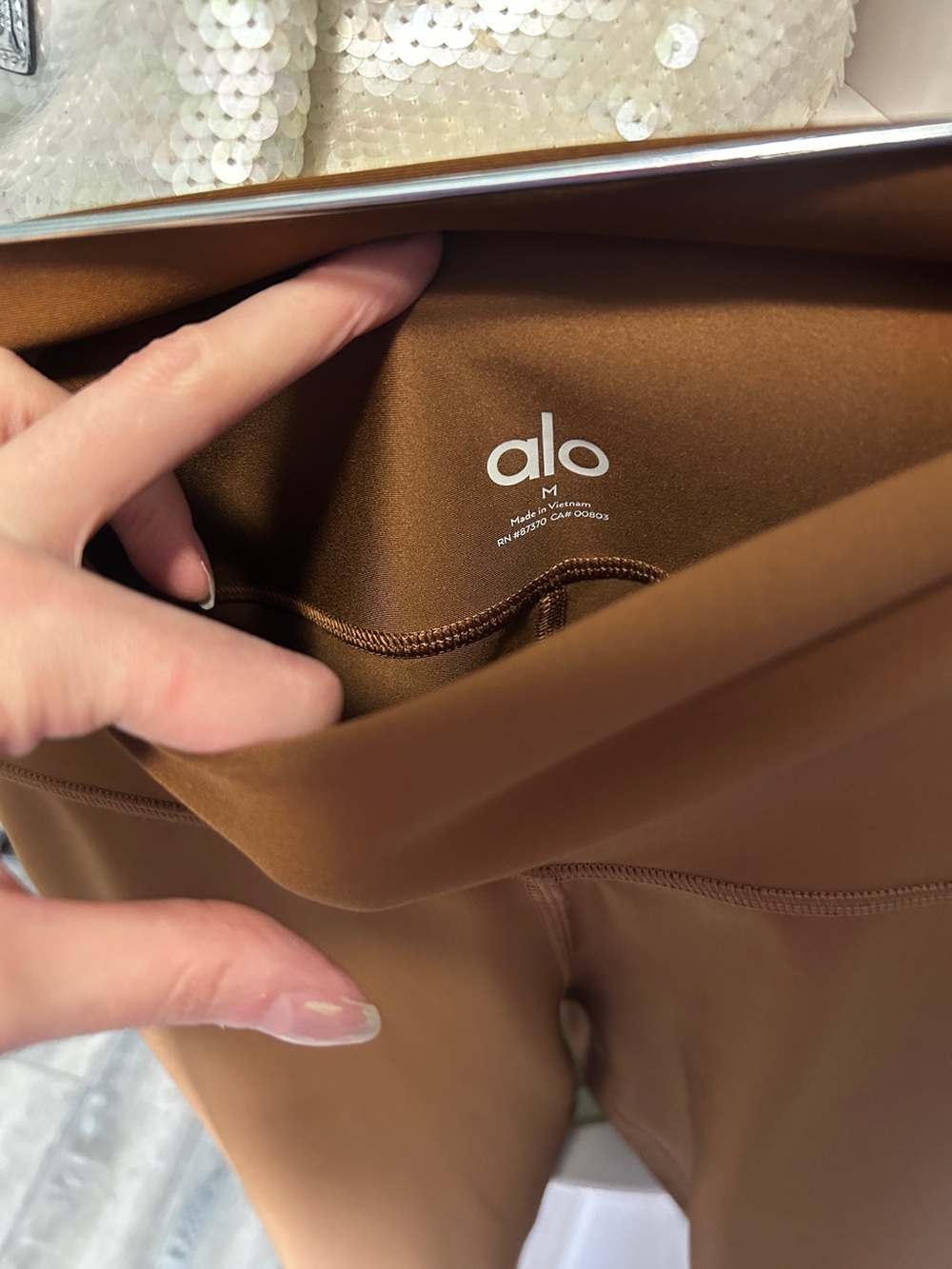 Alo Airlift Leggings in a Copper brown color - Picture 2 of 7